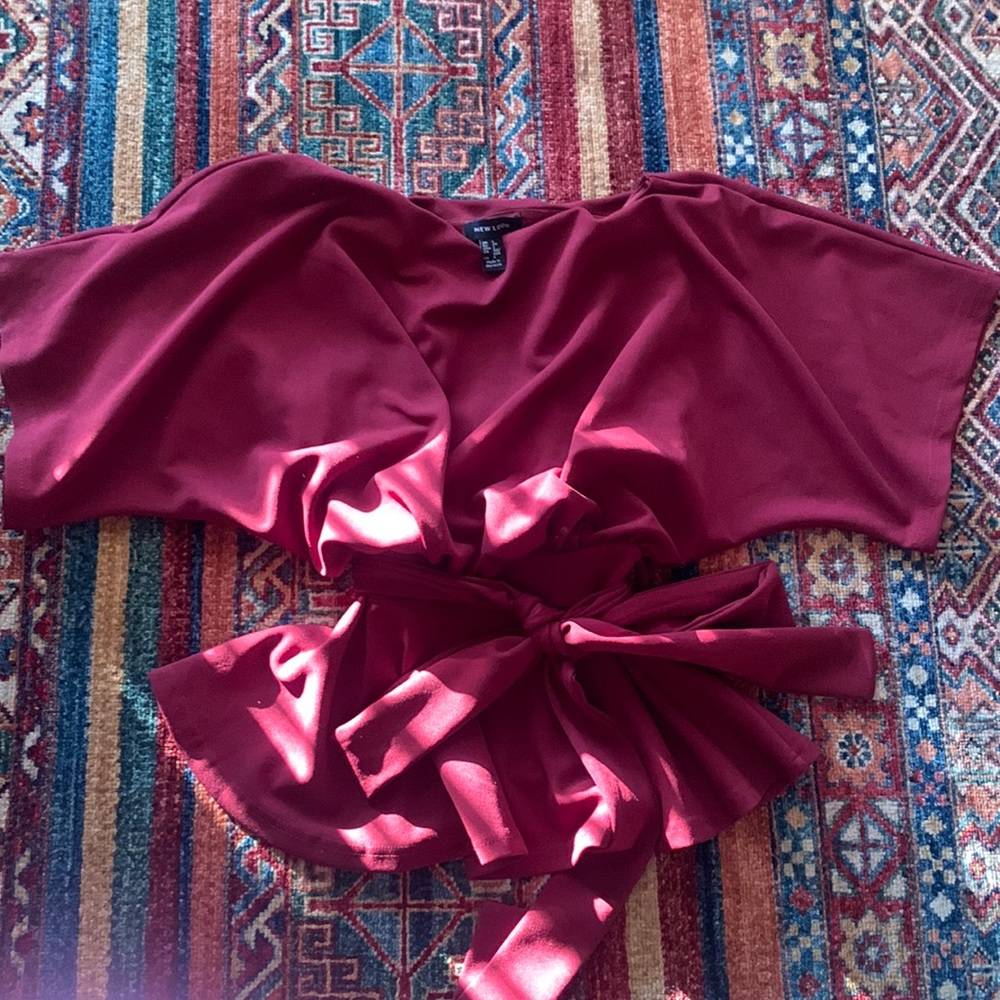 Maroon color top. Only wore this twice and does not fit anymore